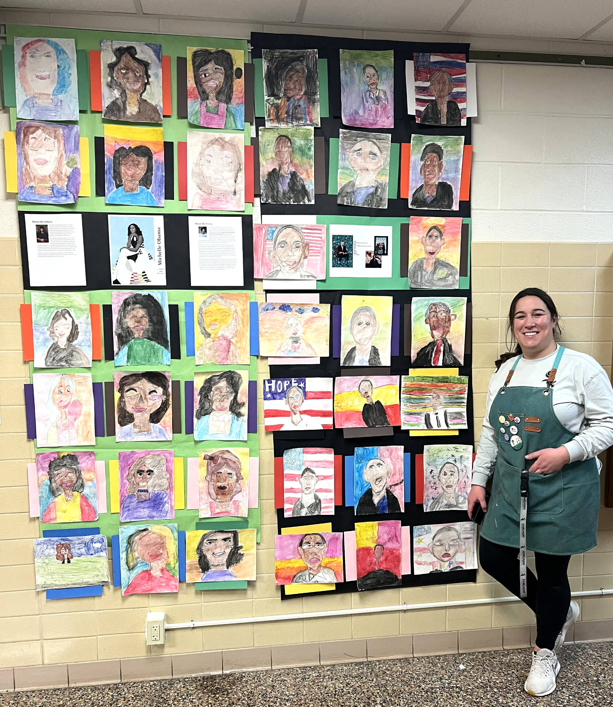Bethany Karn stands next to some of her students' art projects